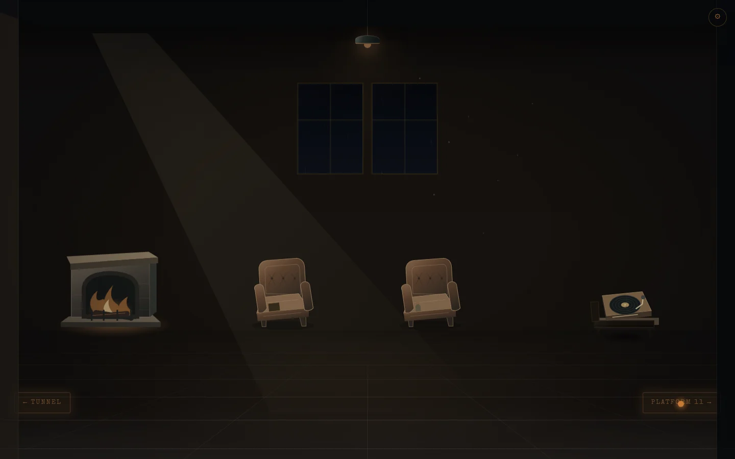 Two armchairs beside a fireplace and a record player in the station waiting room.